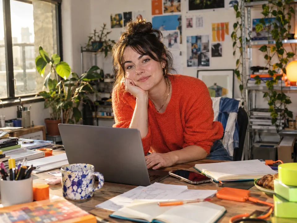 Founder taking a pause at a busy desk